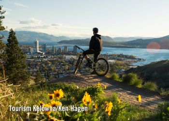Mountain biker overlooking Kelowna from Knox Mountain Park